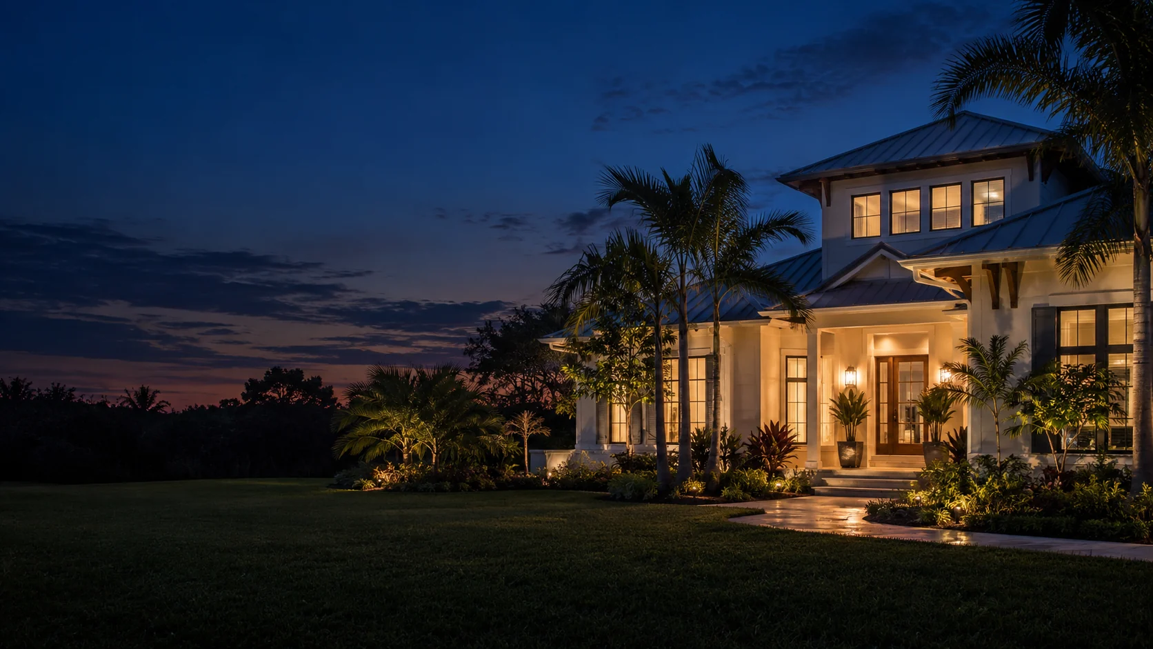 A welcoming home with warmly lit windows at dusk